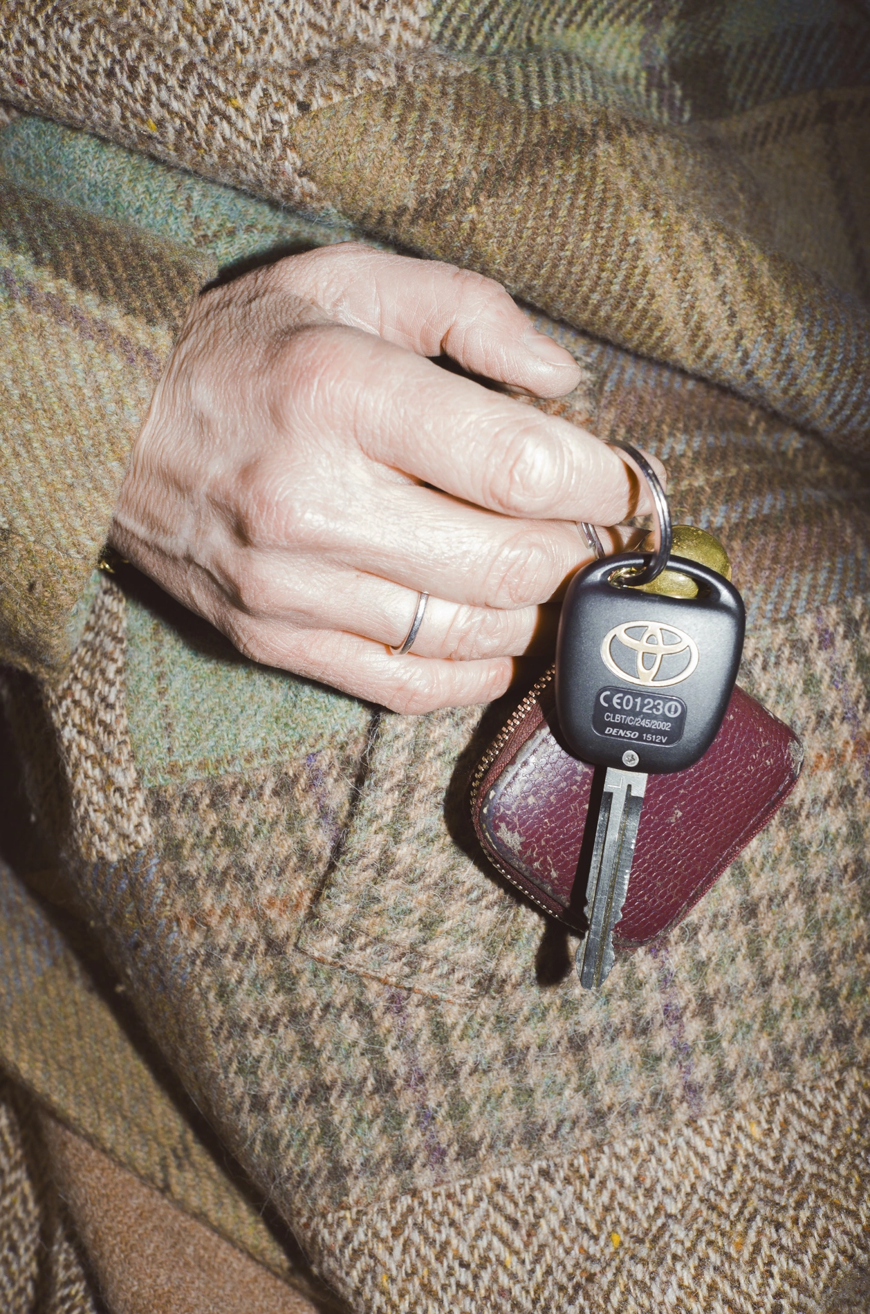 Fashion photograph of a female model holding car keys